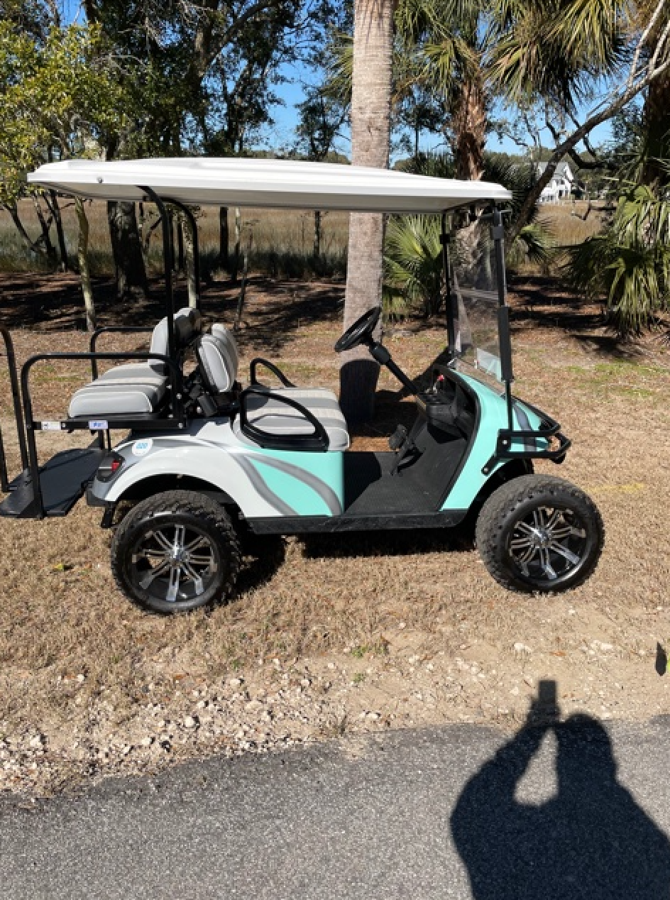 Rent the Custom Lifted Electric 4 Seat Golf Cart Island Golf Cart